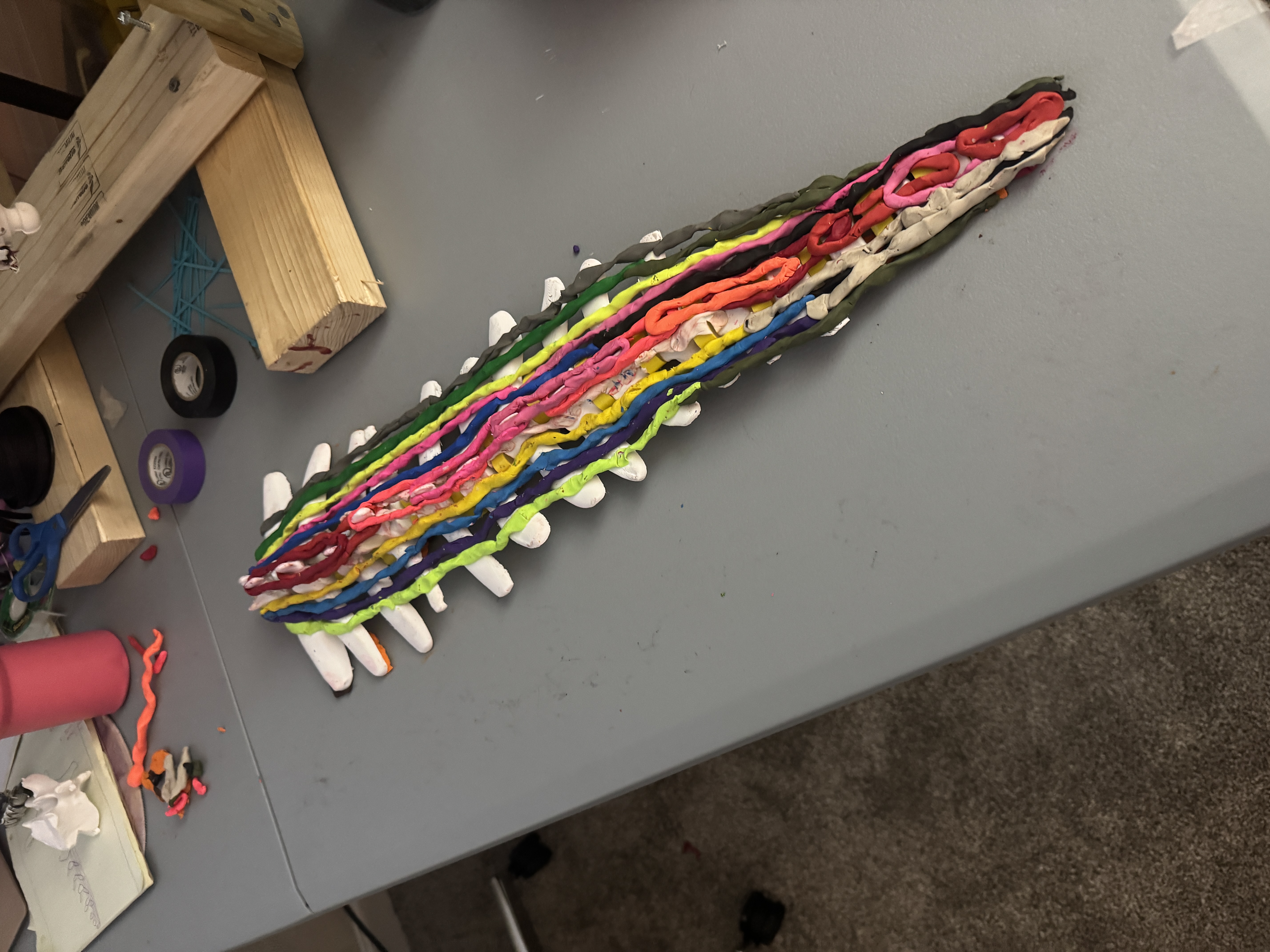 Prototype 9 — top view with color-coded muscle groups on articulated spine